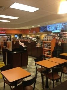 Interior of a coffee shop with tables and counter service